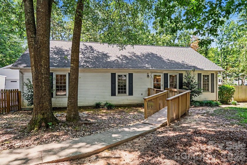 Tucked away on a quiet, tree-lined cul-de-sac, this charming - photo 6