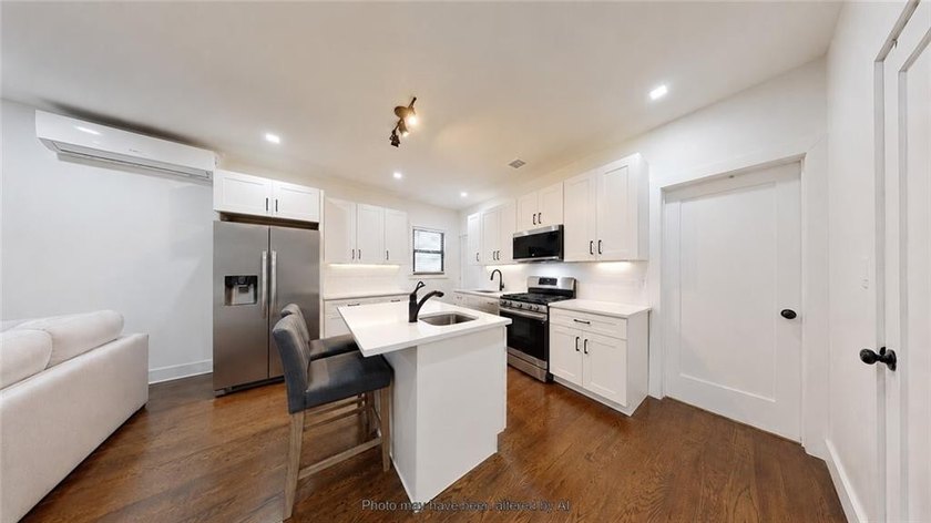 Fully renovated in 2020, this detached single-family home offers - photo 8