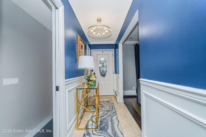 Welcome to 103 Cedar Avenue, a beautifully renovated raised - photo 4