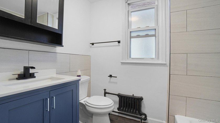 Presenting a beautifully renovated four-level, two-family - photo 14