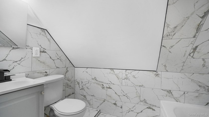 Presenting a beautifully renovated four-level, two-family - photo 19