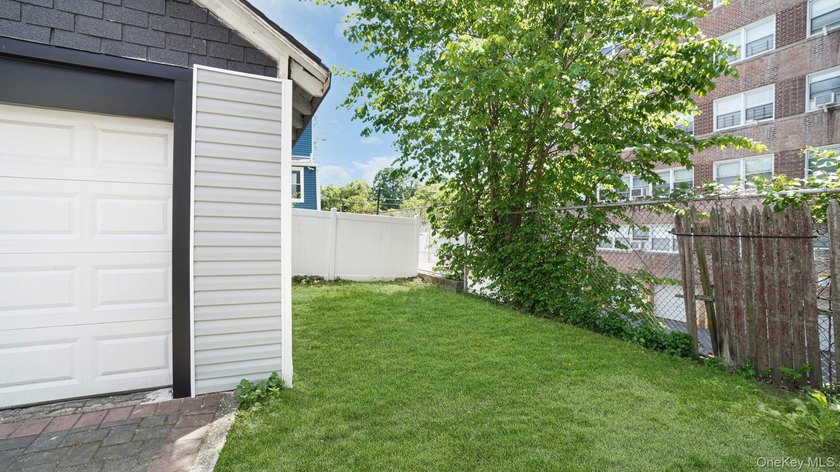 Presenting a beautifully renovated four-level, two-family - photo 23