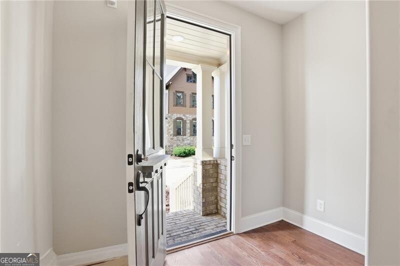 Welcome to this beautifully designed luxury townhome located in - photo 3