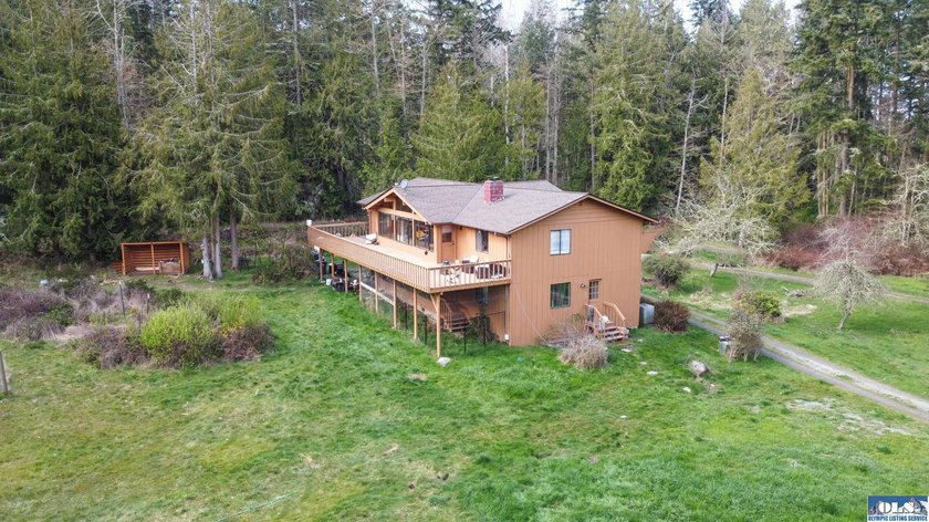 Nestled on 5 private acres in Sequim, this stunning 3 - photo 39