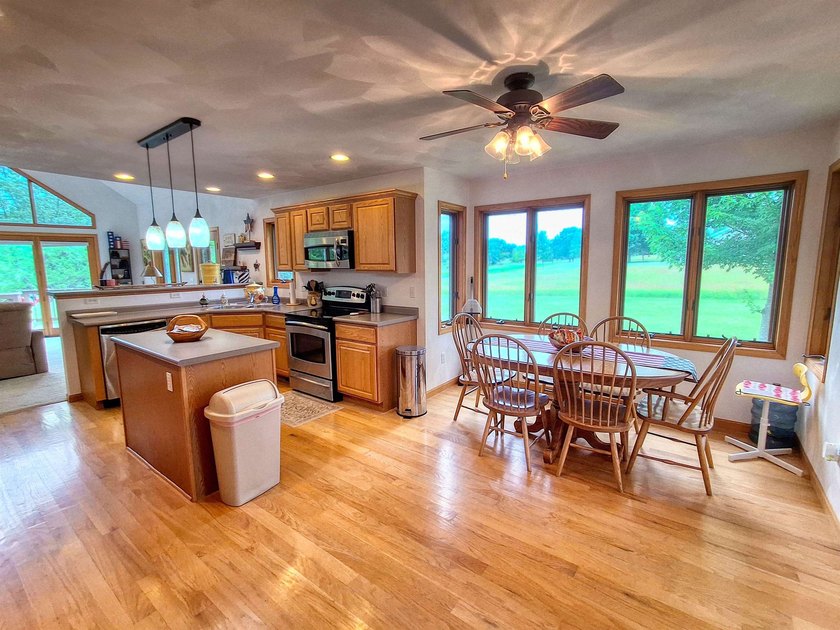Nestled along a stunning golf course with beautiful views of the - photo 8