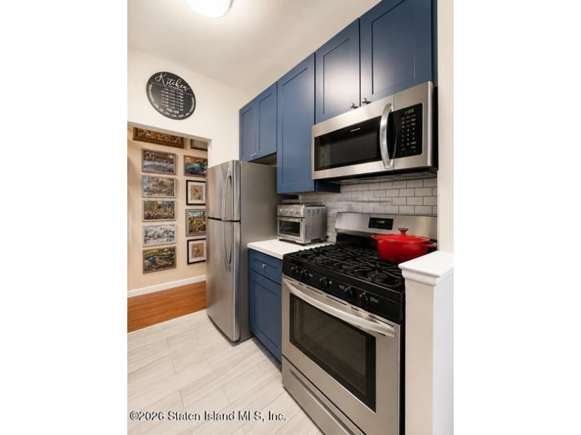 Updated 1-bedroom, 1-bath home featuring a modern kitchen, wood - photo 8