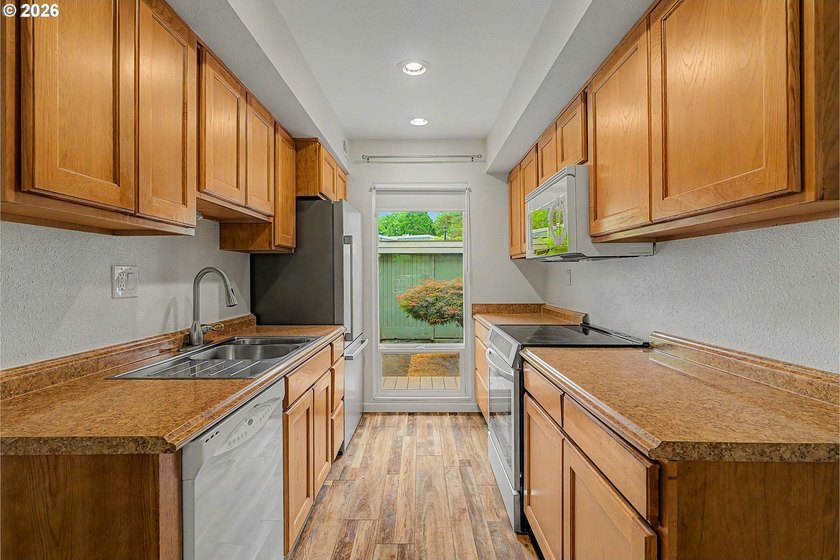 Tucked into a peaceful community surrounded by mature trees - photo 11