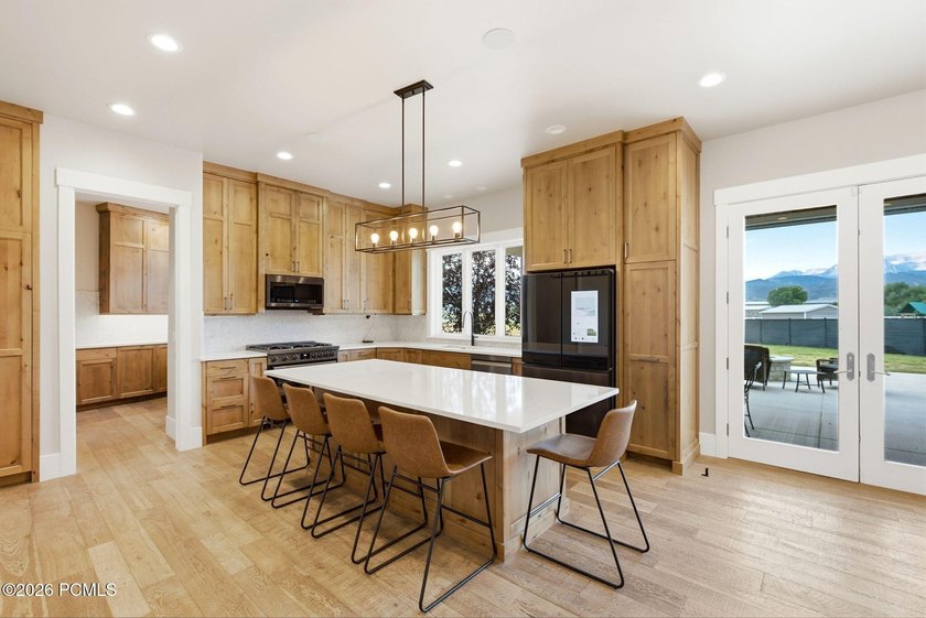 Set on a fully landscaped acre with open views of Mount - photo 6