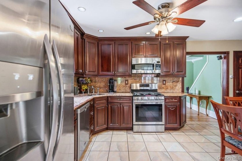 Set on a level, fully fenced property in East Islip, this 3 - photo 9