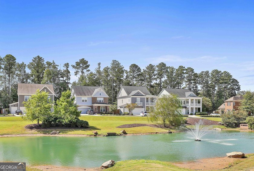 Enjoy peaceful lake and fountain park views directly from the - photo 3