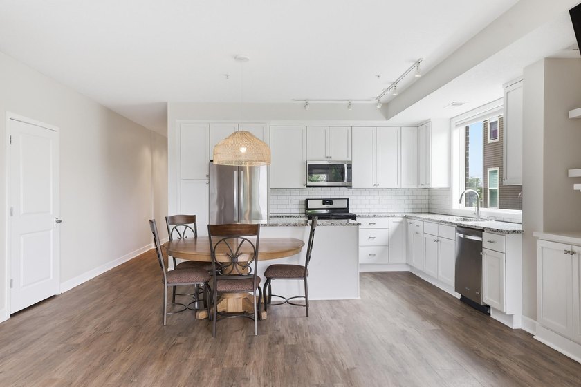 Experience sophisticated, low-maintenance living at **Wooddale - photo 4