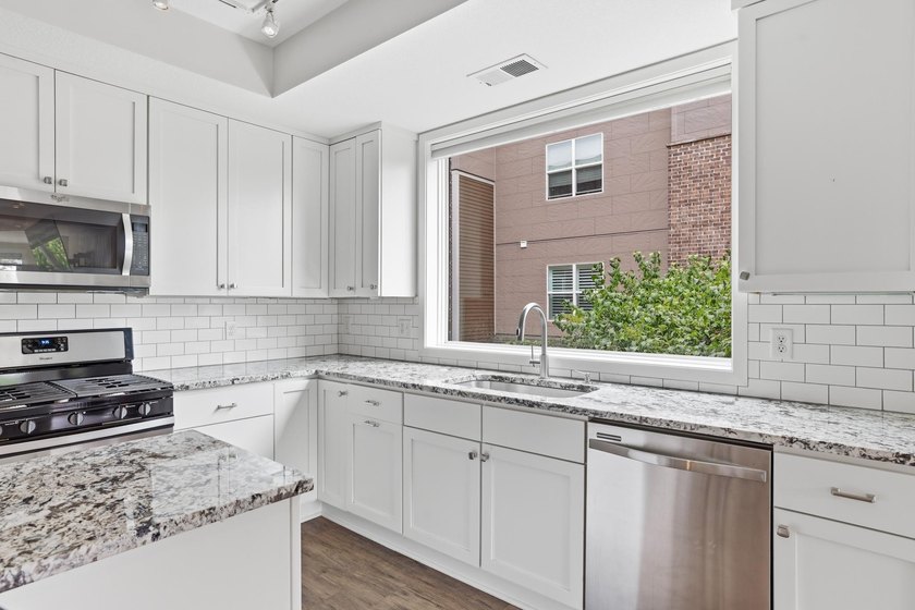 Experience sophisticated, low-maintenance living at **Wooddale - photo 6