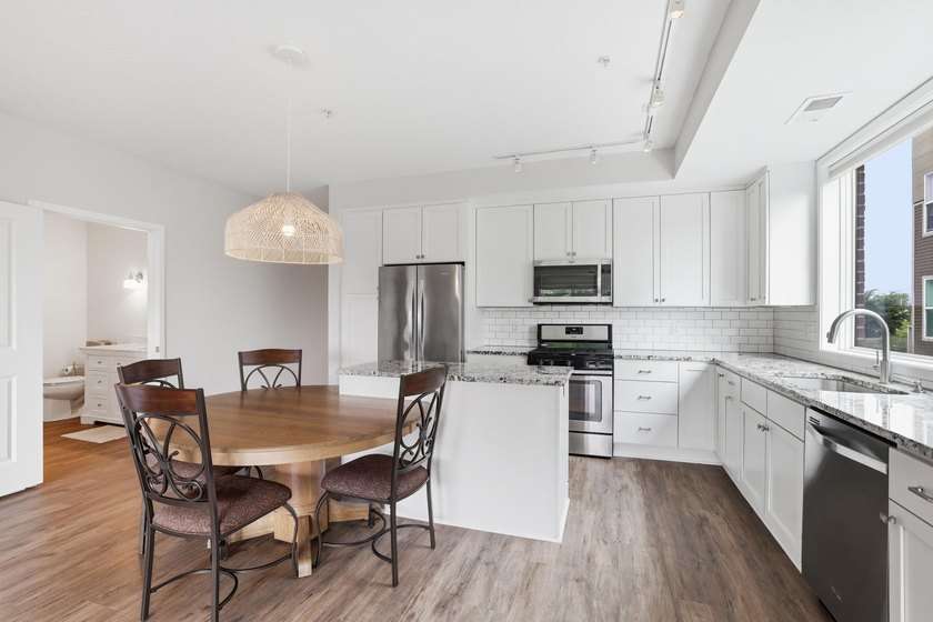 Experience sophisticated, low-maintenance living at **Wooddale - photo 9