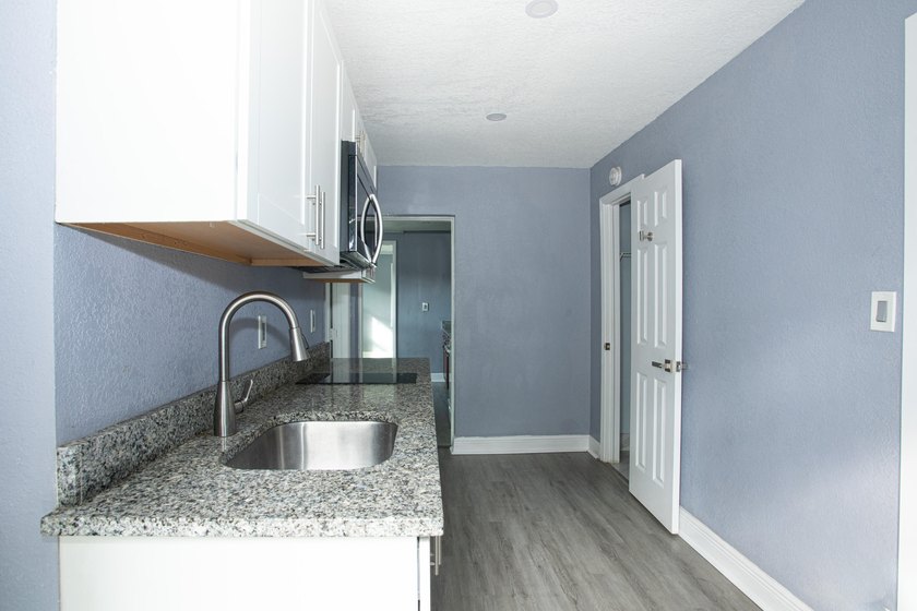 Home is move-in ready! This spacious 4-bedroom, 2-bath - photo 14