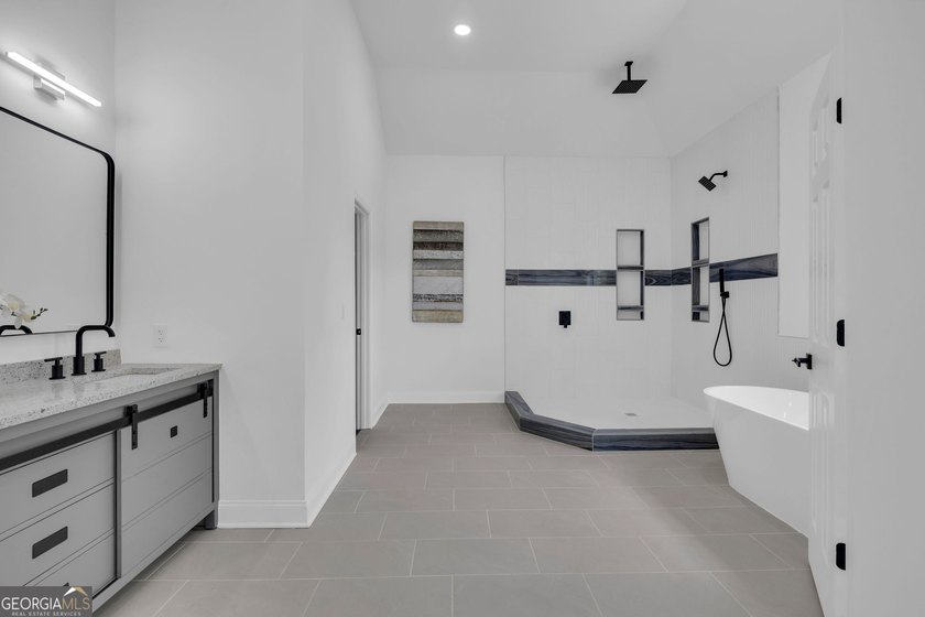 This stunning newly built residence in Douglasville offers the - photo 17