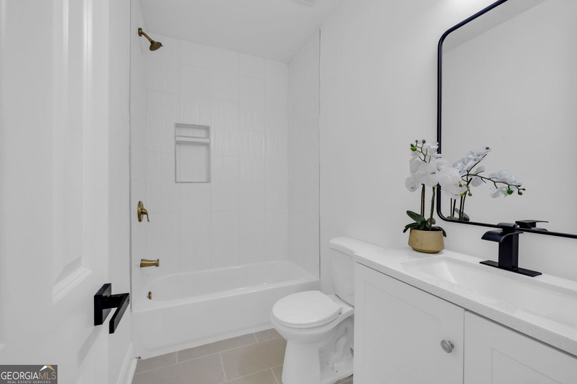 This stunning newly built residence in Douglasville offers the - photo 22