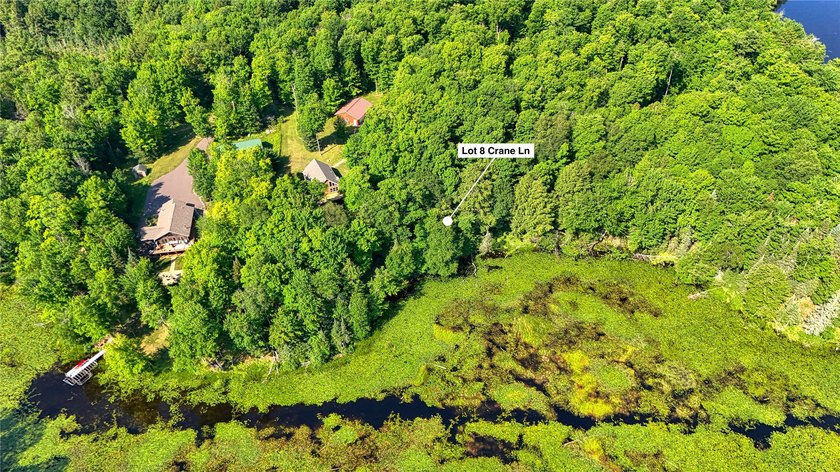 Build your Northwoods getaway on this beautiful waterfront lot - photo 9