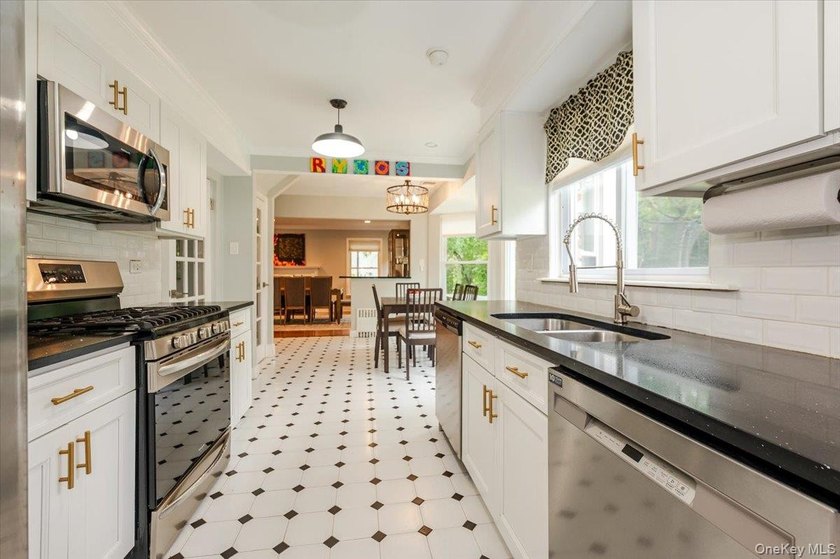 Welcome to this sunlit all brick center hall colonial located in - photo 10