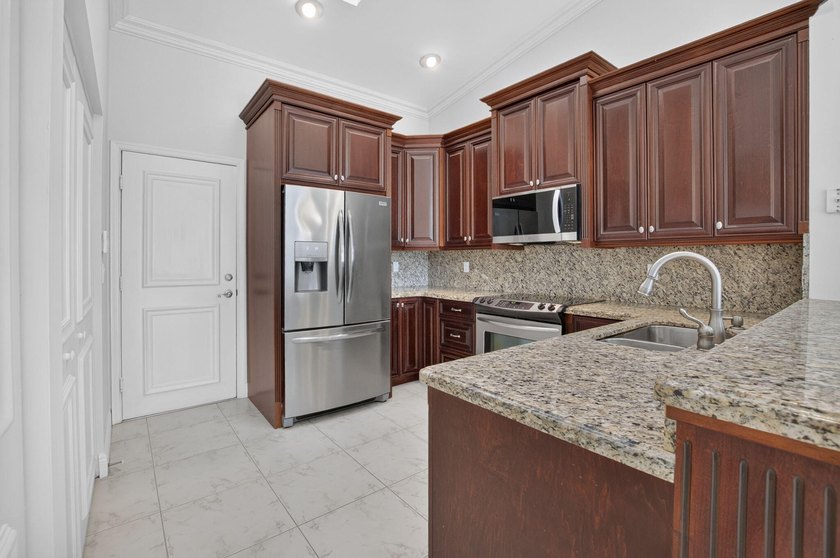 Watch the sunrise from this 3 bedroom-2 bath home on a LAKEFRONT - photo 13
