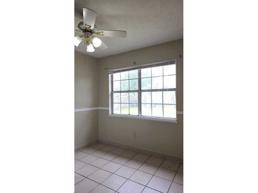 This 3-bedroom, 2-bath home with a garage and fenced backyard - photo 7