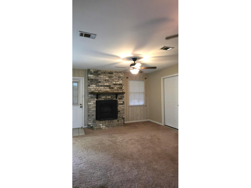 This 3-bedroom, 2-bath home with a garage and fenced backyard - photo 9
