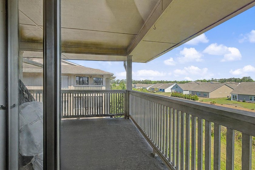 Welcome to this top-floor end-unit condo in Cypress Bay, located - photo 11