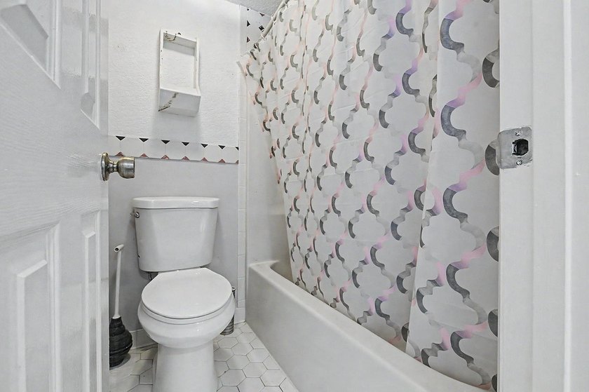 Welcome to this top-floor end-unit condo in Cypress Bay, located - photo 14