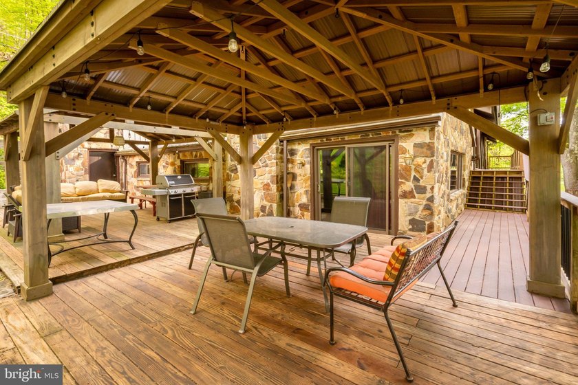Beautiful stone lakefront home! This property has 2 parcels with - photo 15