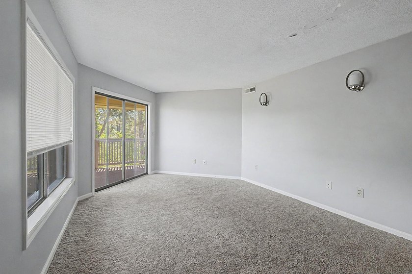 Welcome to this top-floor end-unit condo in Cypress Bay, located - photo 17