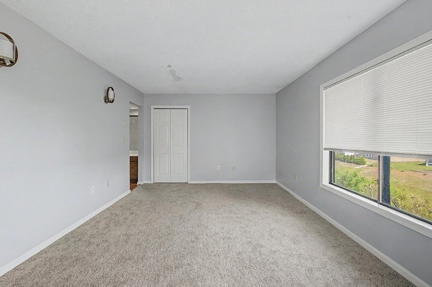 Welcome to this top-floor end-unit condo in Cypress Bay, located - photo 18