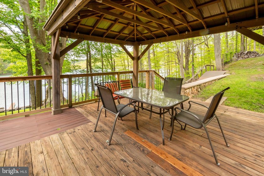 Beautiful stone lakefront home! This property has 2 parcels with - photo 18