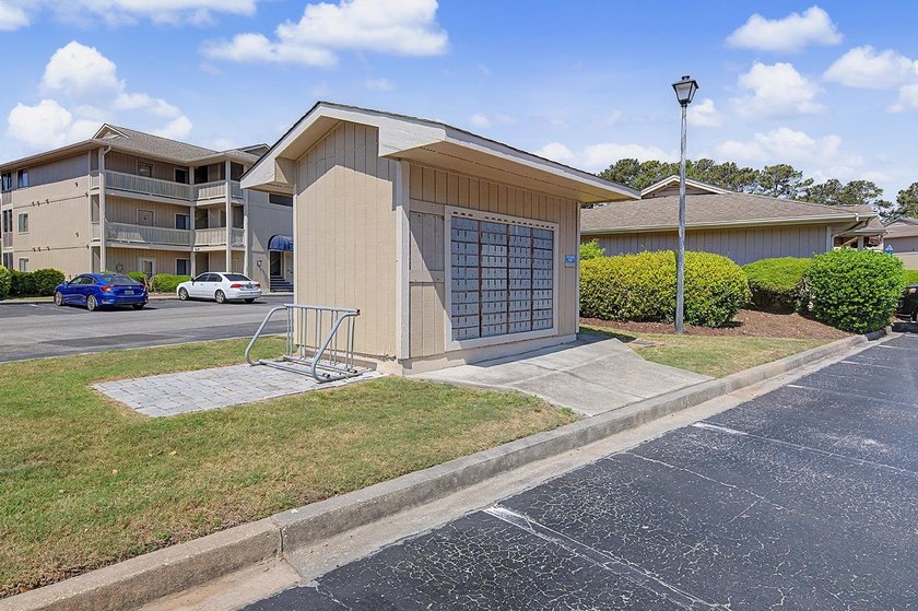 Welcome to this top-floor end-unit condo in Cypress Bay, located - photo 28