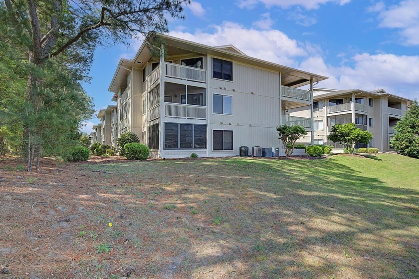 Welcome to this top-floor end-unit condo in Cypress Bay, located - photo 31