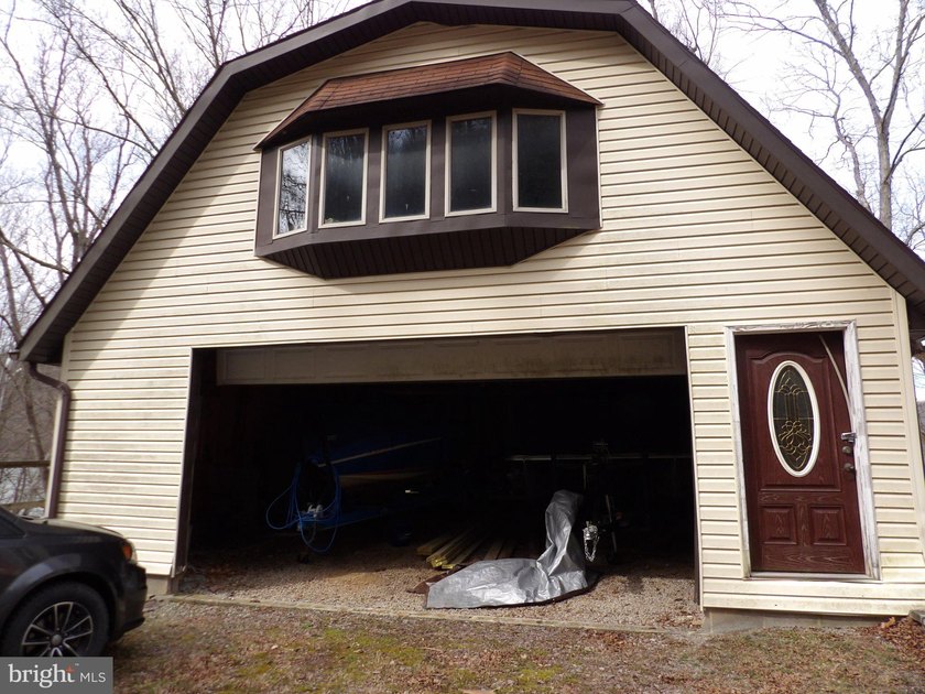 Beautiful stone lakefront home! This property has 2 parcels with - photo 49