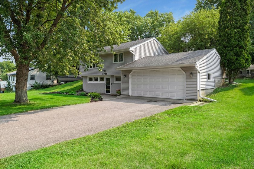 This walkout rambler is nestled on a quiet street with easy - photo 2