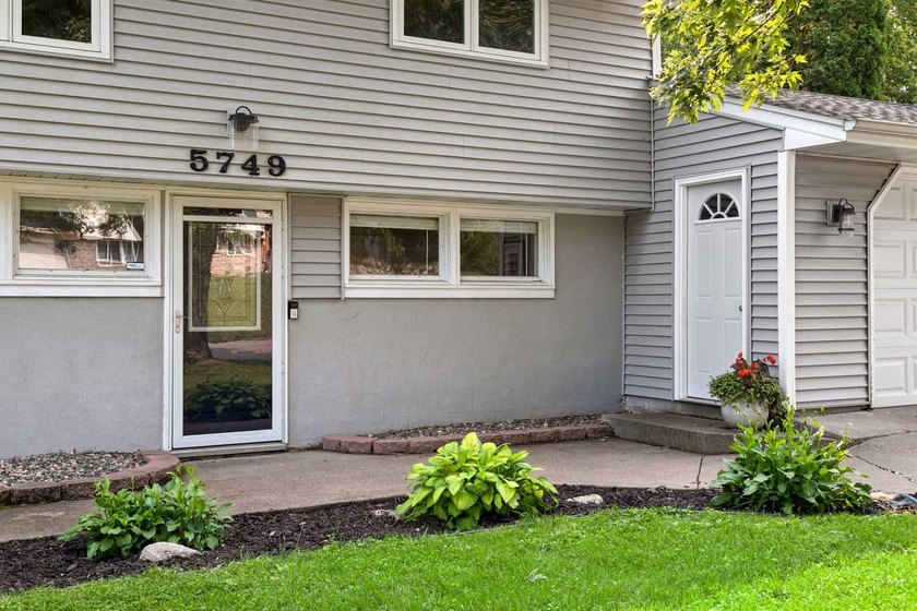 This walkout rambler is nestled on a quiet street with easy - photo 3