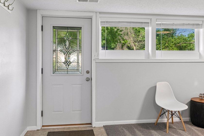 This walkout rambler is nestled on a quiet street with easy - photo 4