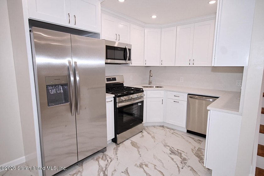 NO NEED TO RENT WHEN YOU CAN OWN THIS BEAUTIFUL NEWLY RENOVATED - photo 4