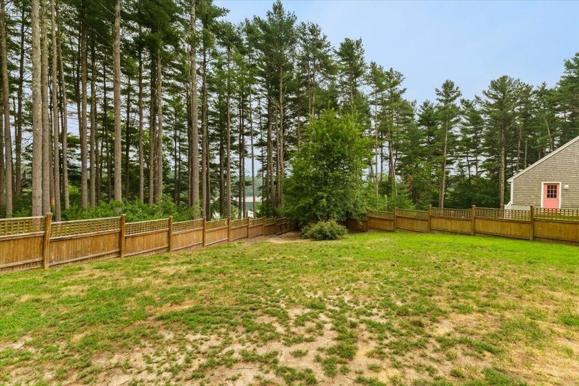 Overlooking Tihonet Pond, 22 Red Pine Lane offers a distinctive - photo 6