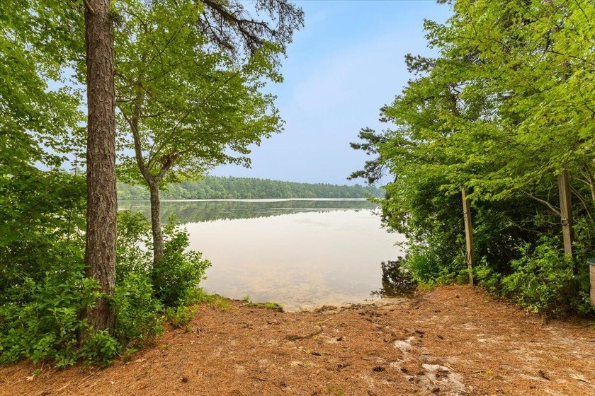 Overlooking Tihonet Pond, 22 Red Pine Lane offers a distinctive - photo 8
