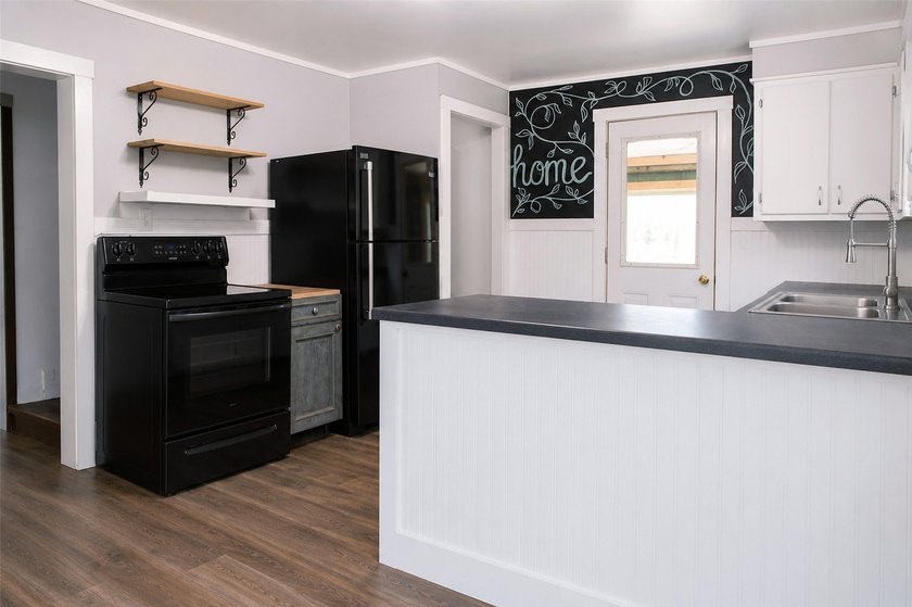 This updated home is move-in ready with fresh flooring, paint - photo 4