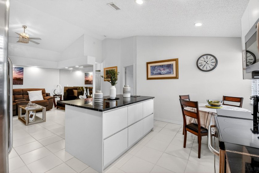 Welcome to a beautifully reimagined lakefront Turnkey home. This - photo 7