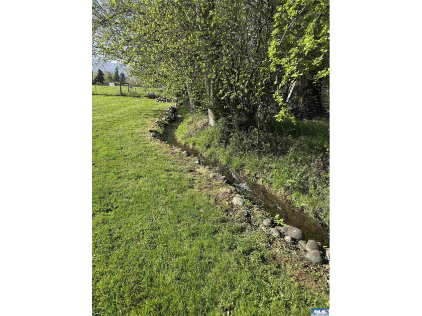 Set on 1.3 acres with beautiful mountain views, this property - photo 22