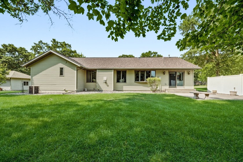Beautifully maintained and set on a corner lot, this ranch-style - photo 3