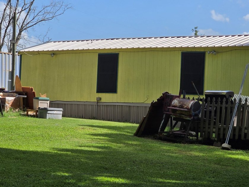 Clean well kept single wide mobile home with metal roof. Along - photo 3