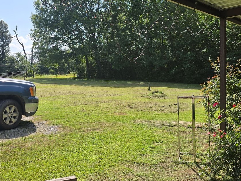 Clean well kept single wide mobile home with metal roof. Along - photo 4