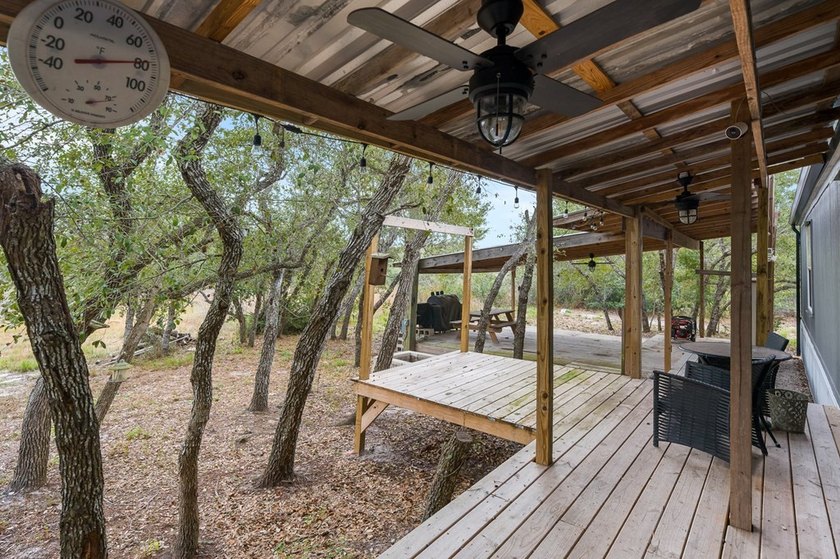 Nestled on wooded land along a quiet road, this newer - photo 21