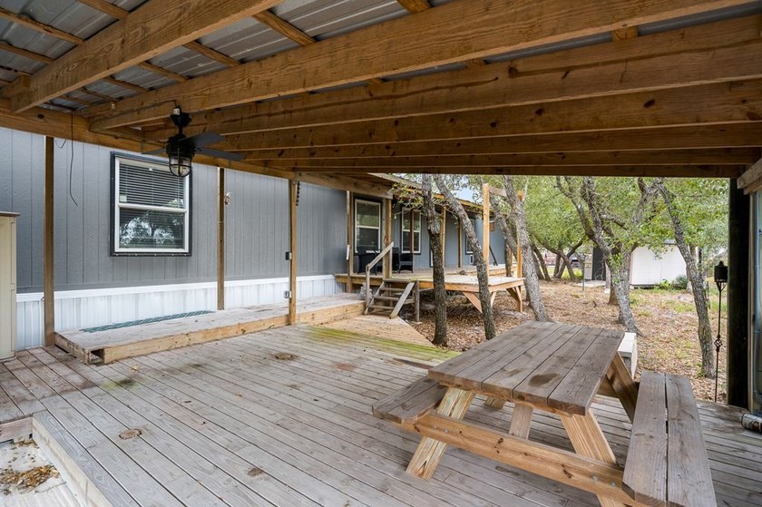 Nestled on wooded land along a quiet road, this newer - photo 23