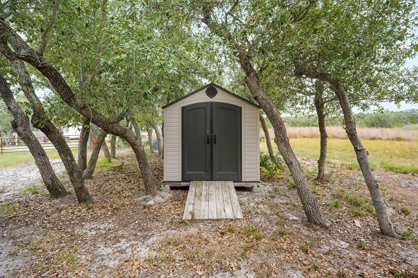 Nestled on wooded land along a quiet road, this newer - photo 25