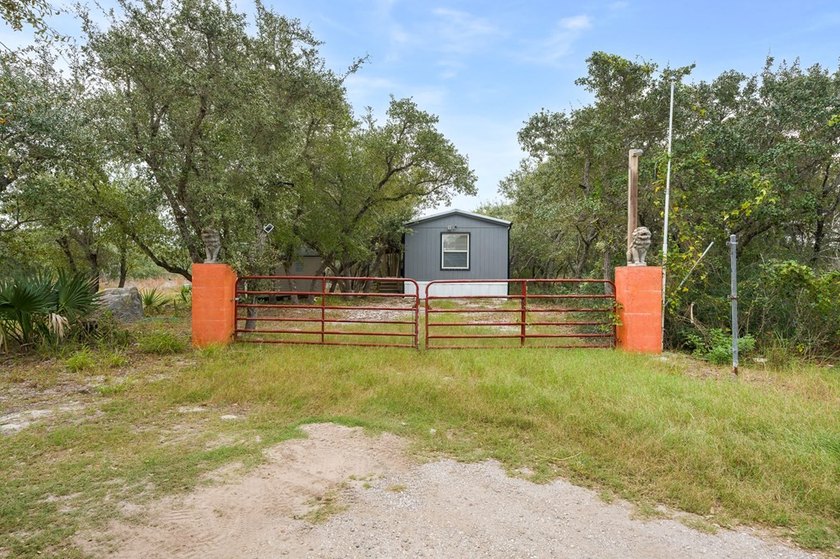 Nestled on wooded land along a quiet road, this newer - photo 26